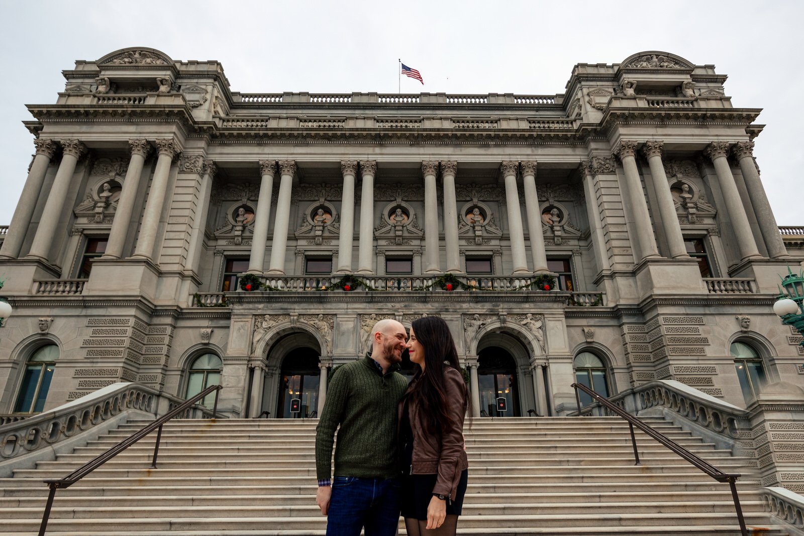 A couple in front of the Library of Congress.