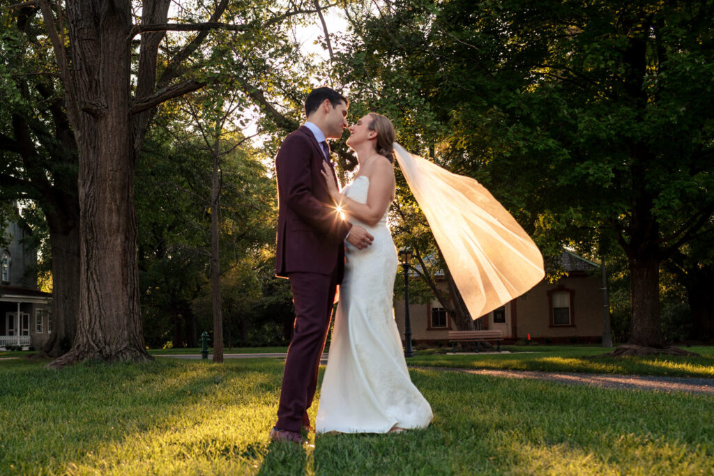 Newlyweds posing at President Lincoln’s Cottage during sunset