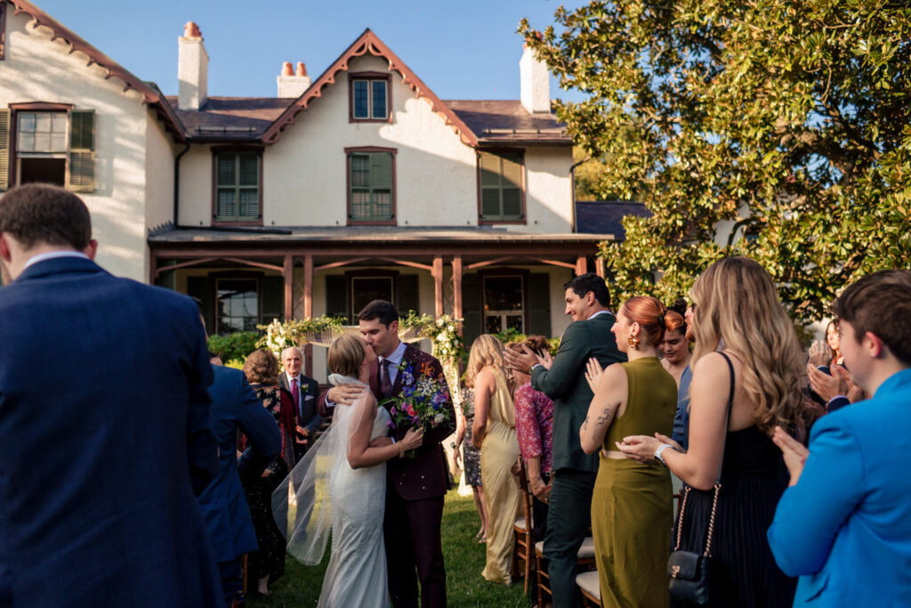 Outdoor wedding ceremony setup at President Lincoln’s Cottage with a magnolia tree and the historic house in the background